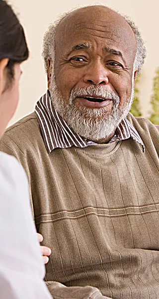 elder man smiling at companion